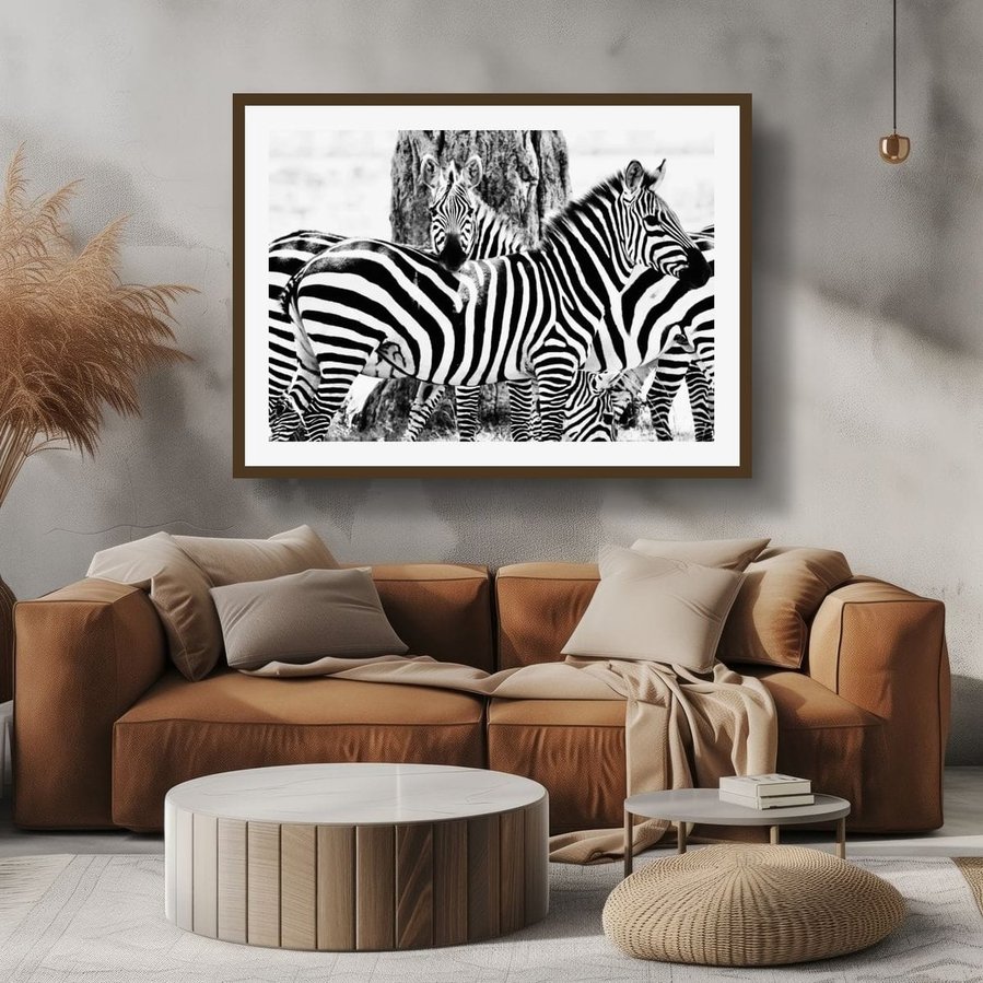 Black and white fine art photograph of zebras in close formation, with one resting its head across another’s back. Striking patterns, high contrast, and emotional connection captured in a timeless wildlife composition.