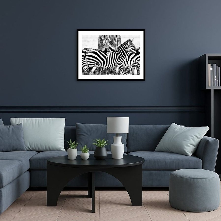 Black and white fine art photograph of zebras in close formation, with one resting its head across another’s back. Striking patterns, high contrast, and emotional connection captured in a timeless wildlife composition.