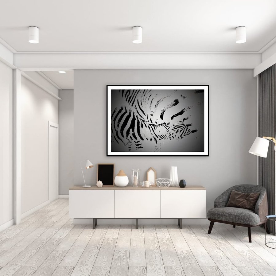 Black and white abstract zebra artwork of a mother nursing her foal. A striking fine art wildlife image highlighting maternal bond, bold contrast, and natural intimacy.