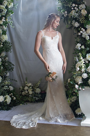 A bridal portrait, bride in white gown with flowers. 