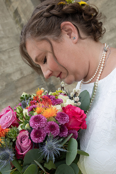 Bridal portrait holding flowers. 