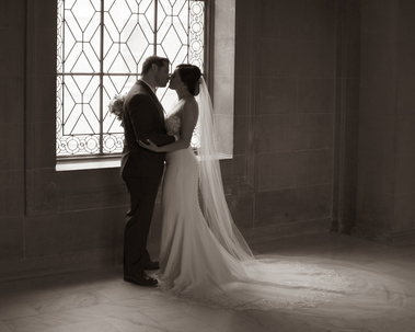 A black and white portrait of a married couple. 