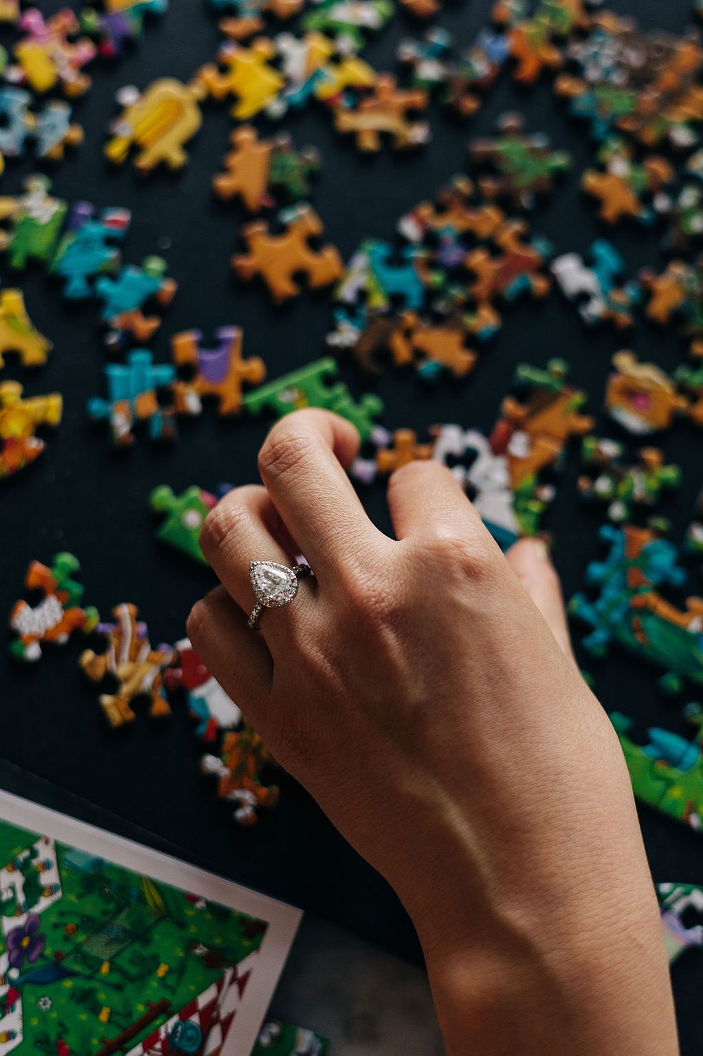 documentary style engagement photoshoot at home in the philadelphia suburbs engagement ring with puzzle pieces 