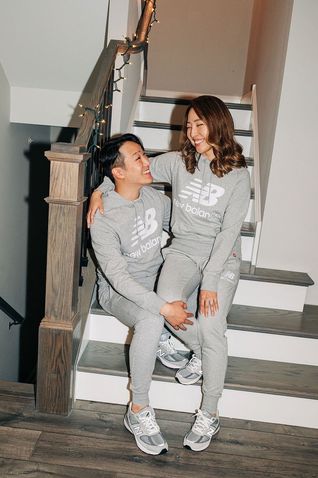 documentary style engagement photoshoot at home in the philadelphia suburbs featuring couple with matching new balance sneakers