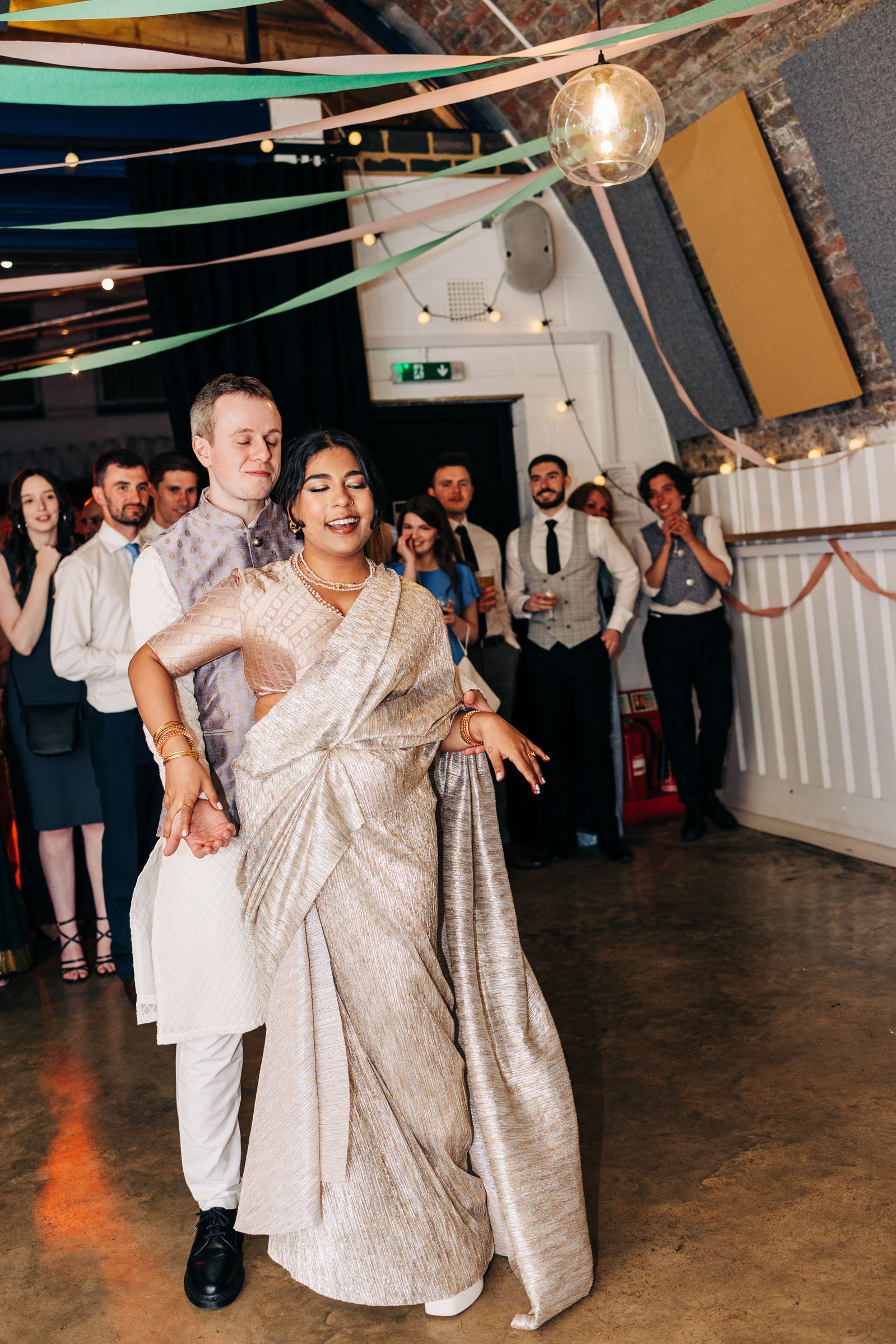 Wedding reception party at AMP Studios London colorful multicultural wedding
