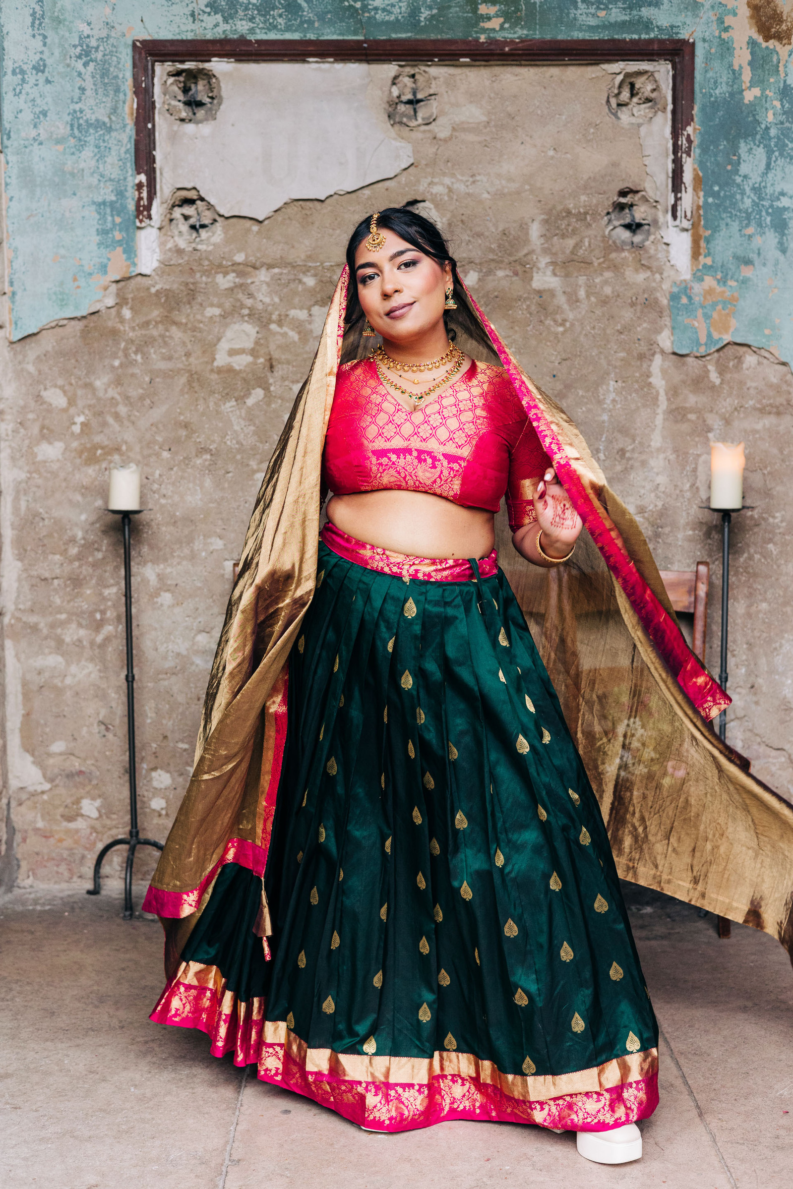 colorful multicultural british indian wedding at asylum chapel in london england UK wedding bride wearing hot pink and emerald green sari from nalli silks