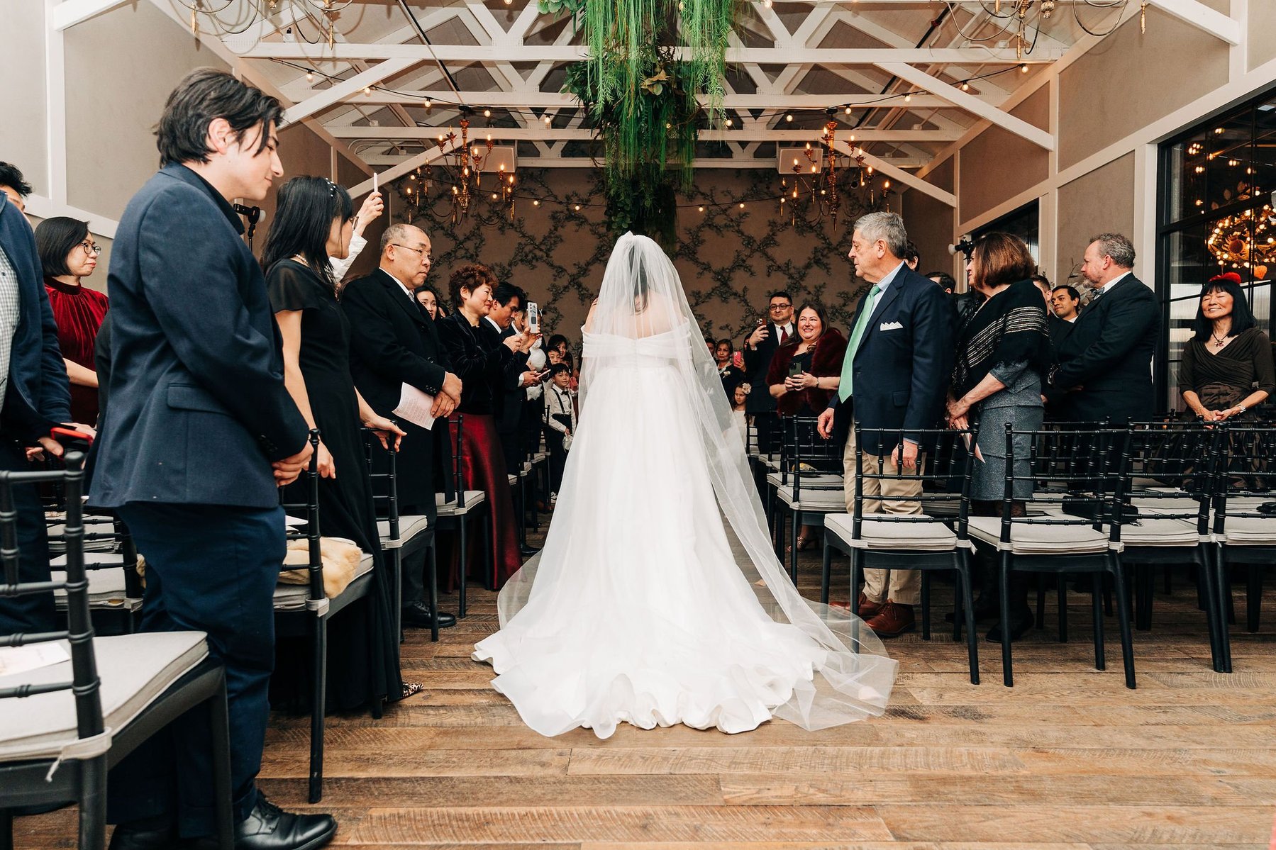 bride walking down the aisle at terrain wedding venue