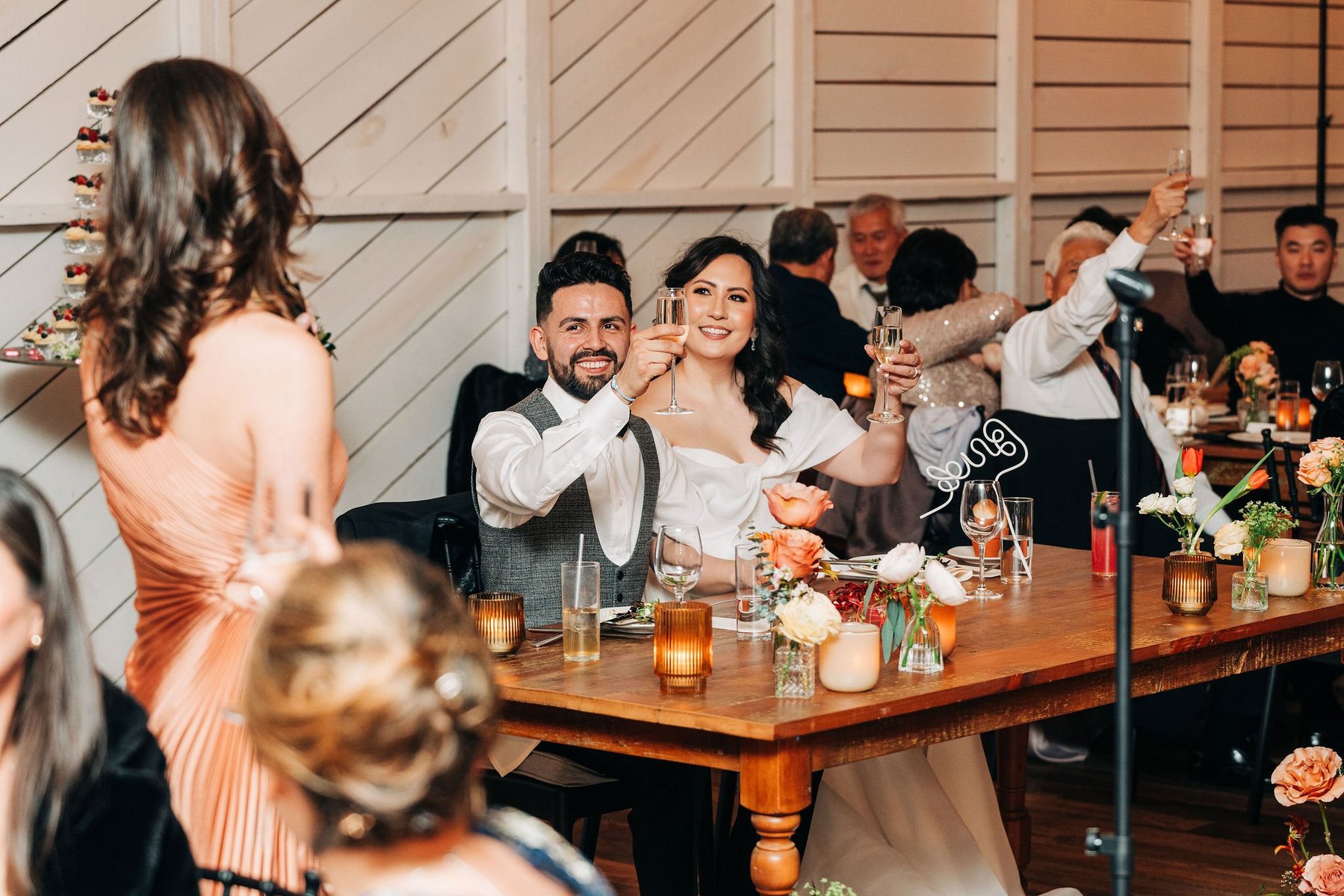 wedding reception at terrain delval venue near philadelphia by documentary style wedding photographer toasts cheers speech