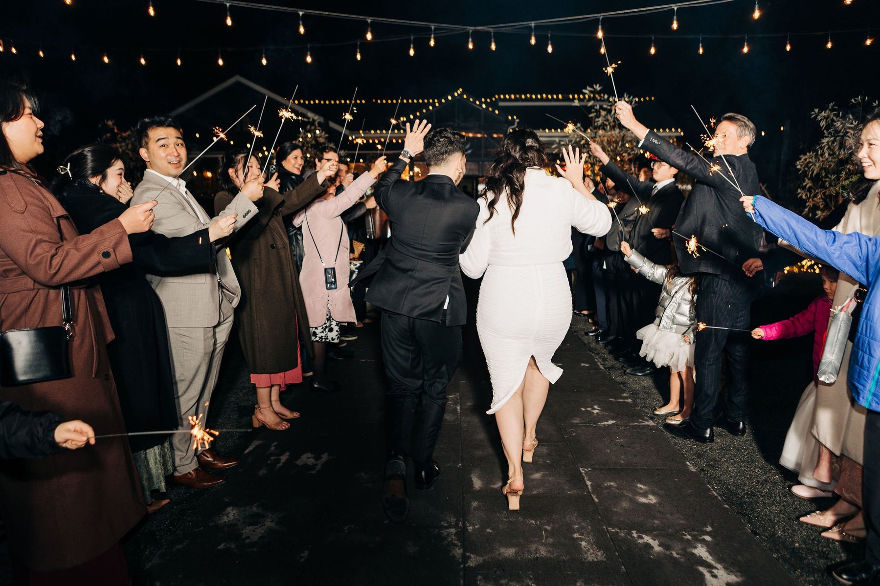 bride and groom wedding sparkler exit at terrain delval wedding venue near philadelphia pennsylvania 