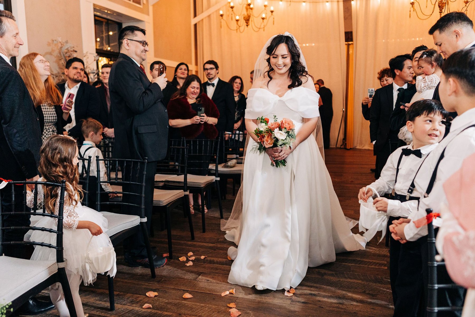 bride walking down the aisle at terrain wedding venue