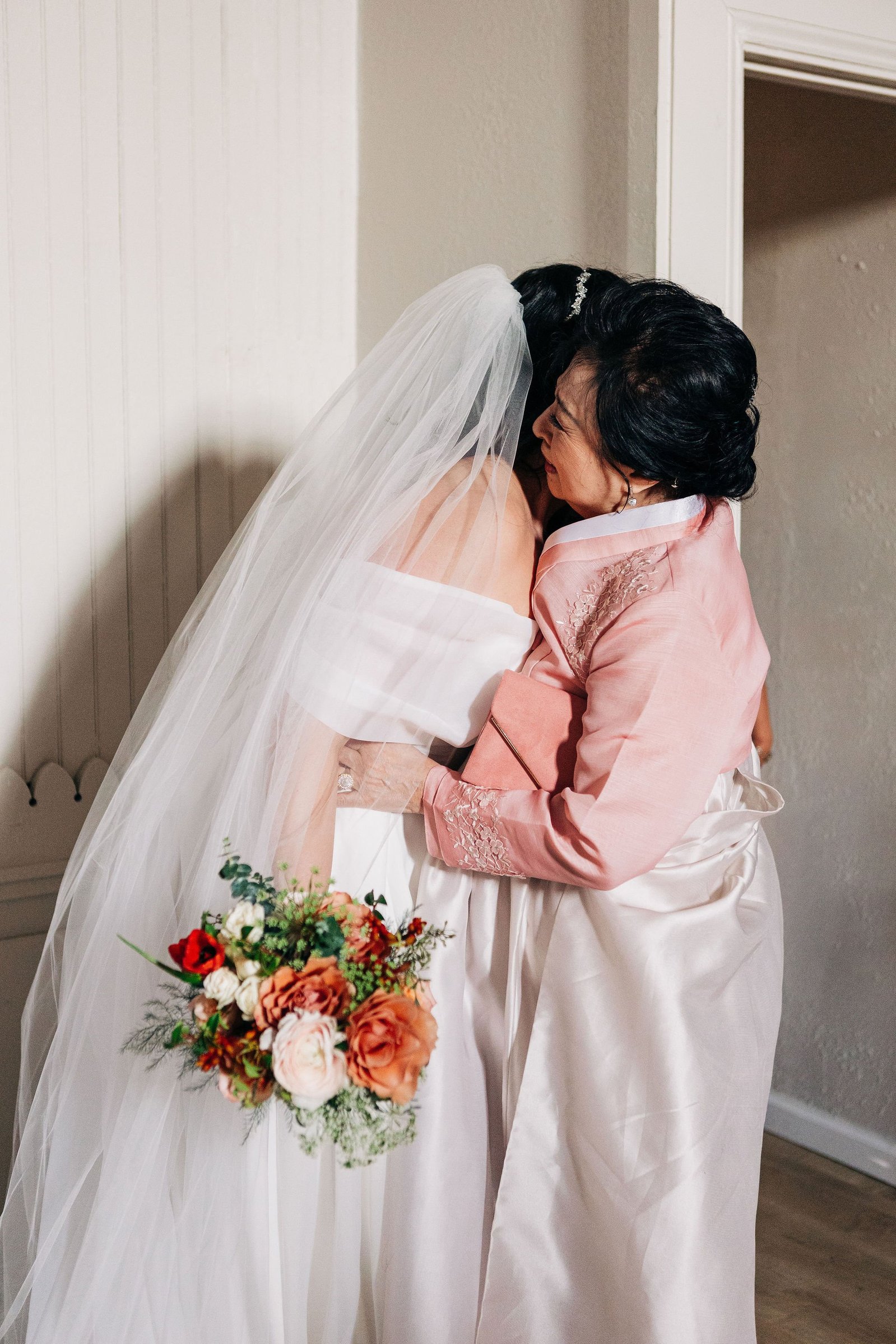 bride first look with mom getting ready for wedding
