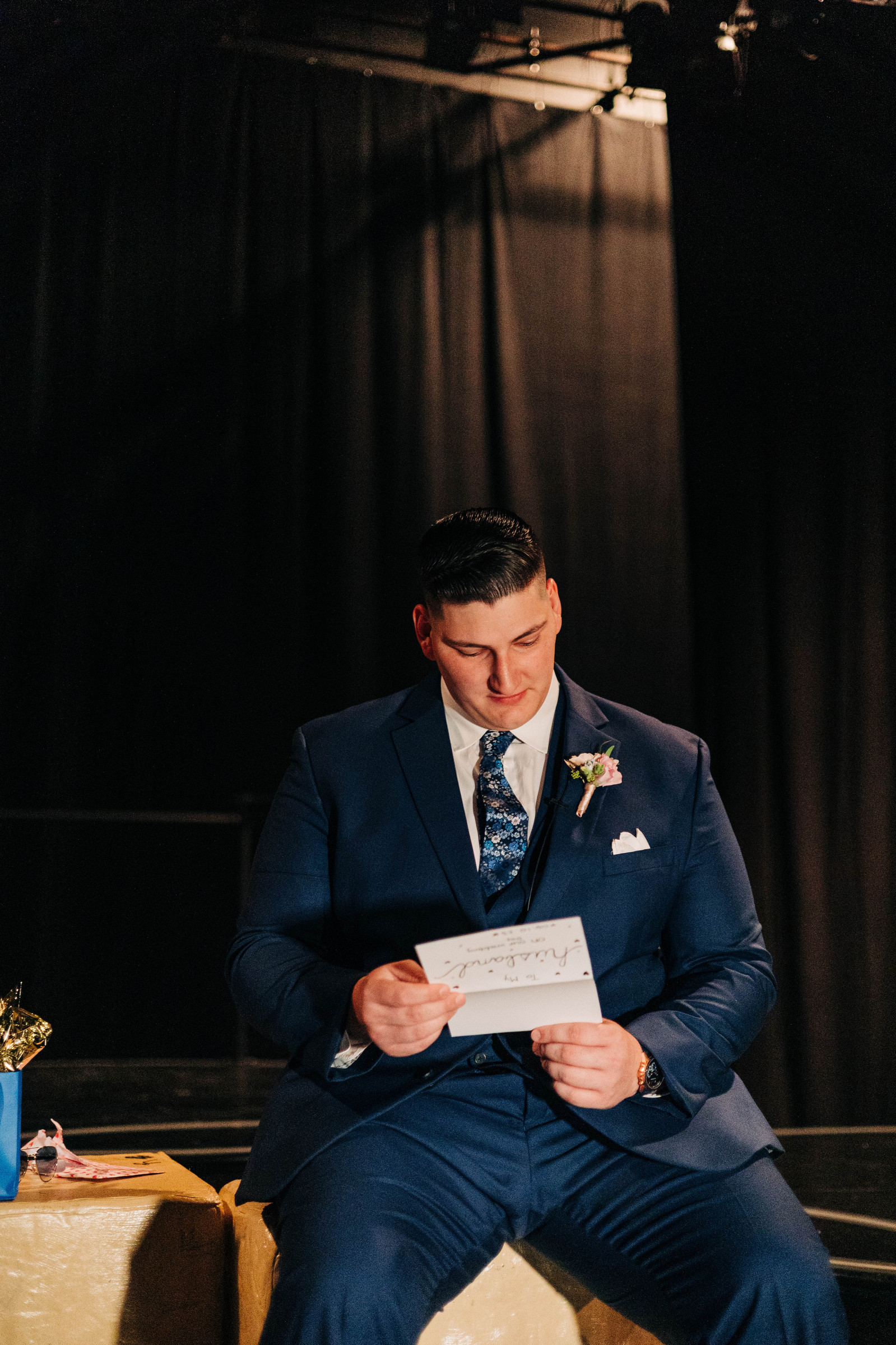 groom reading bride's letter to her on wedding day