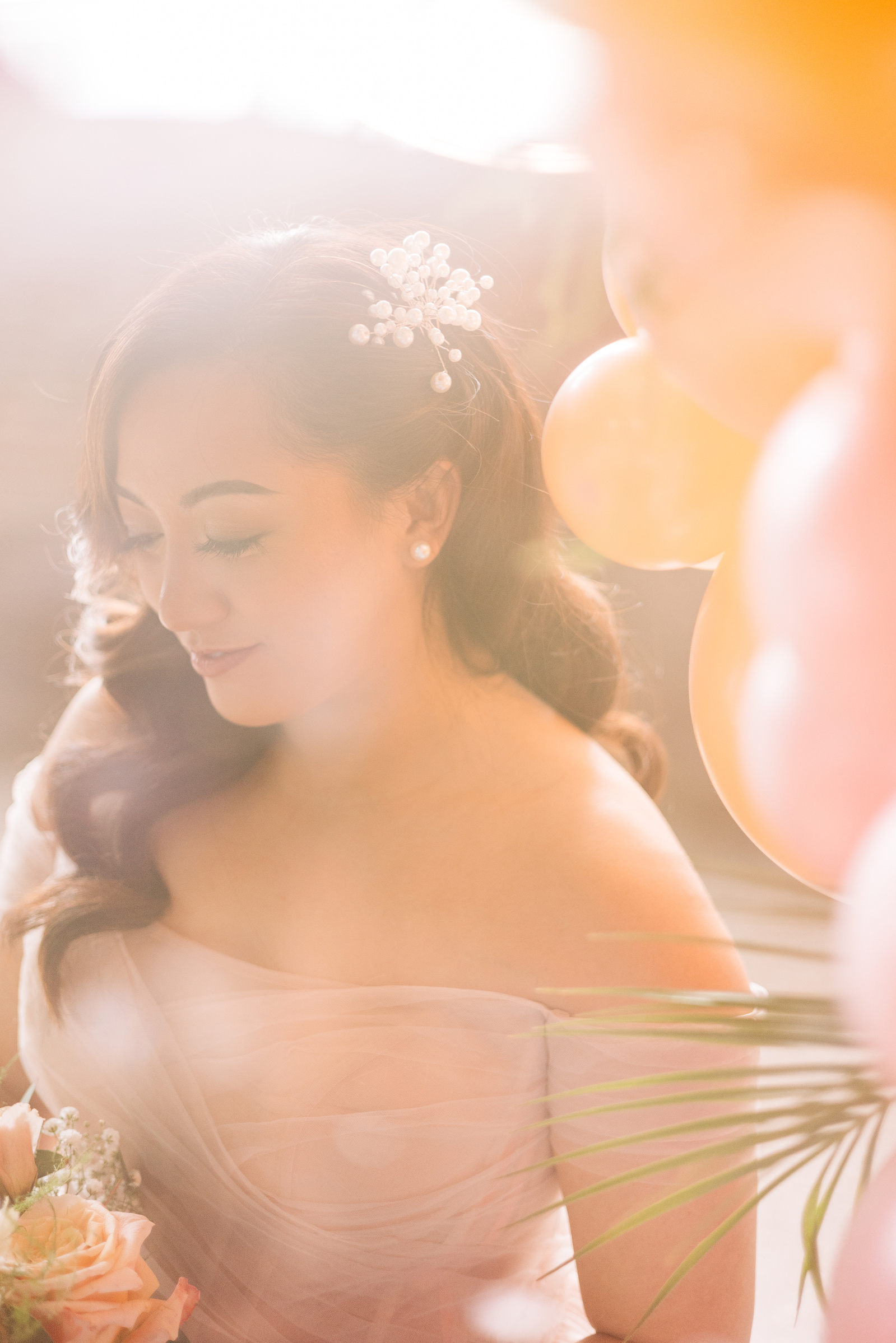 abstract portrait of bride with balloons and hollywood hair