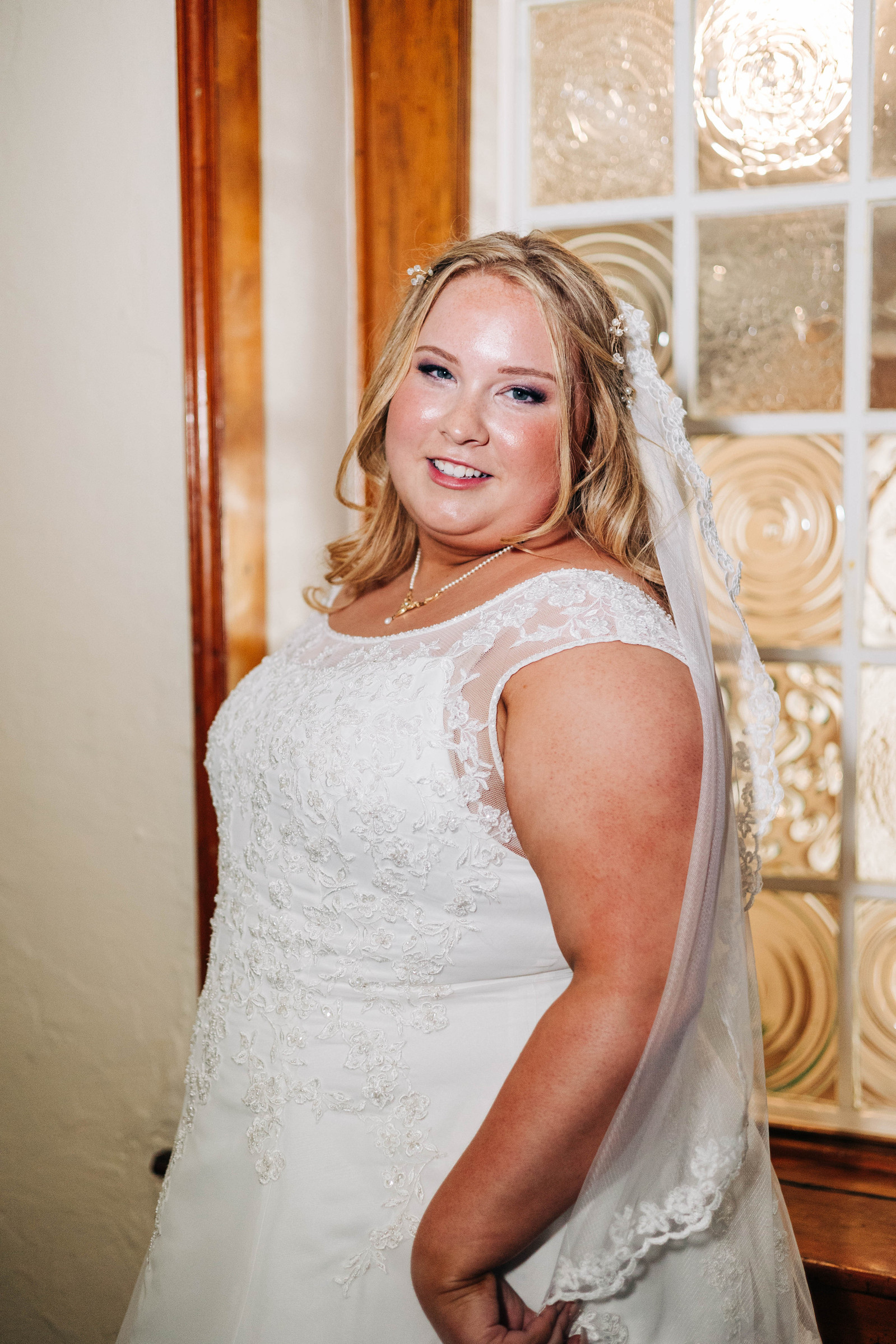 portrait of bride getting ready on her wedding day at the people's light theater in malvern pennsylvania 