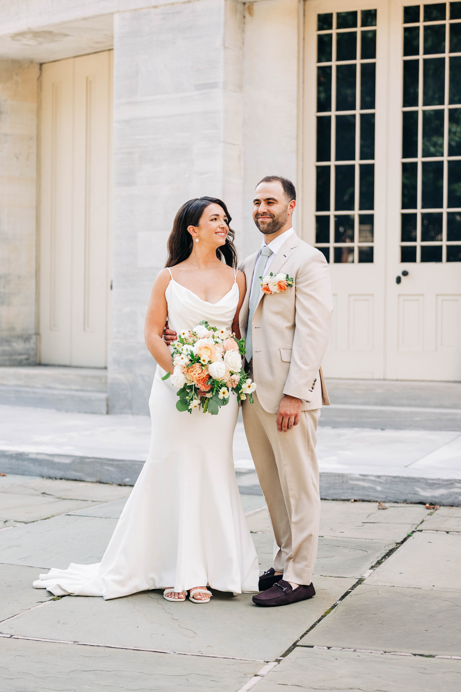 bride and groom at the merchant's exchange building in philly