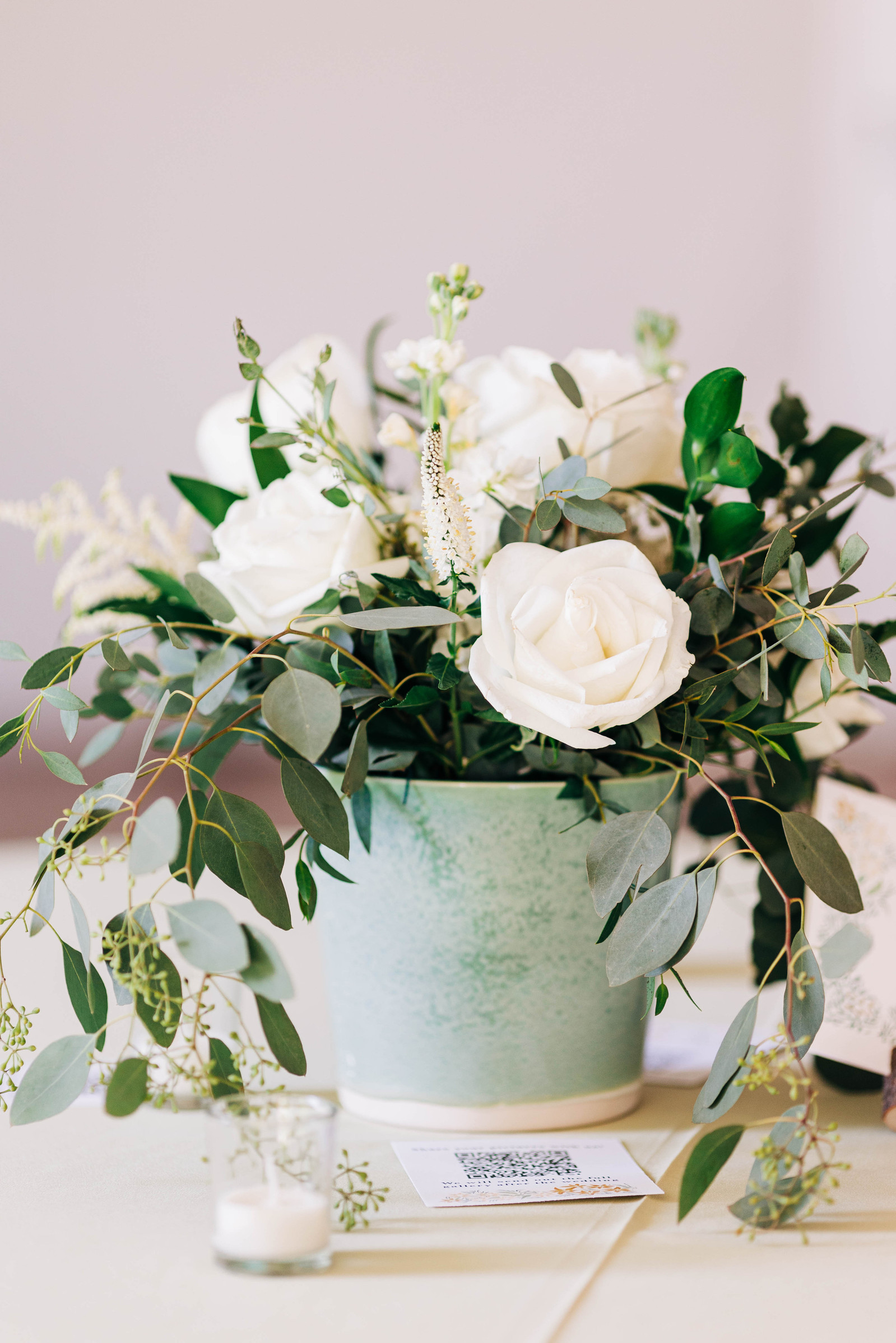 wedding centerpiece with white roses and ceramic handmade flower pot