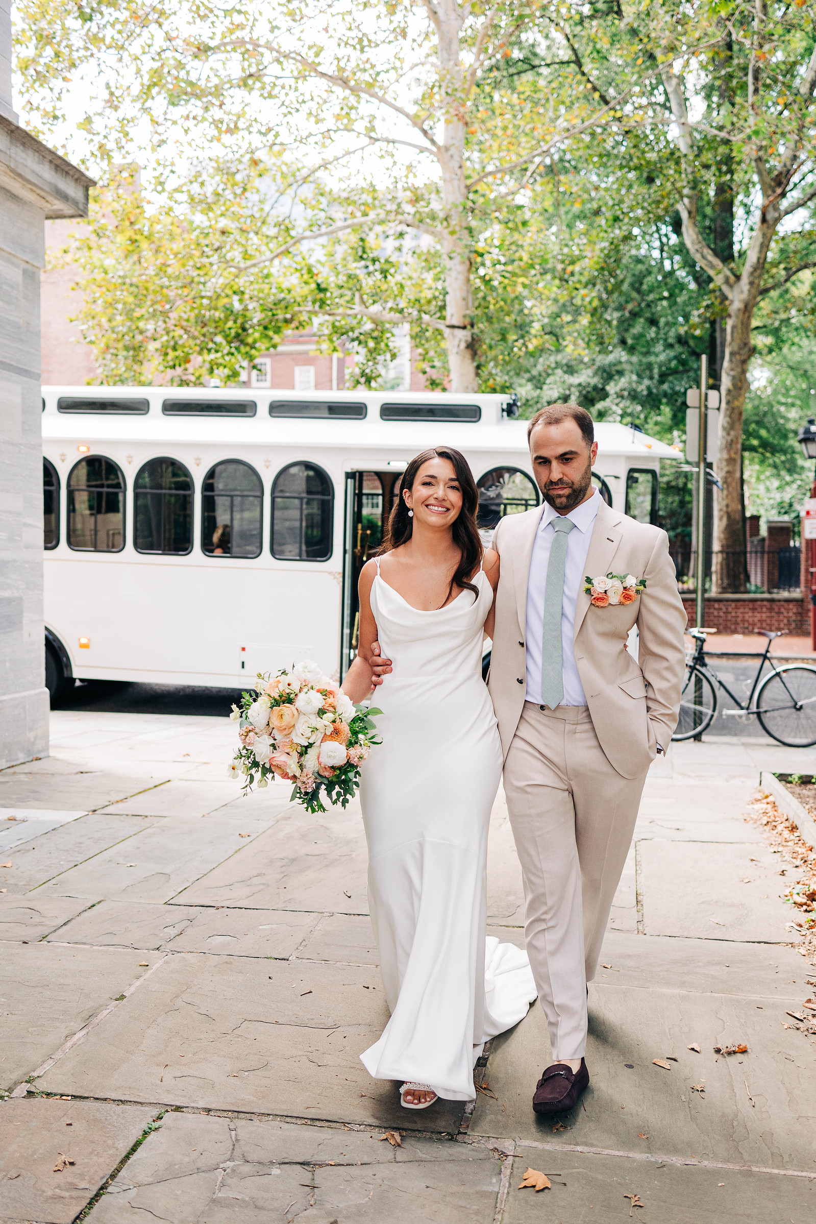 candid wedding photography bride and groom walking in old city philadelphia cescaphe wedding trolley 