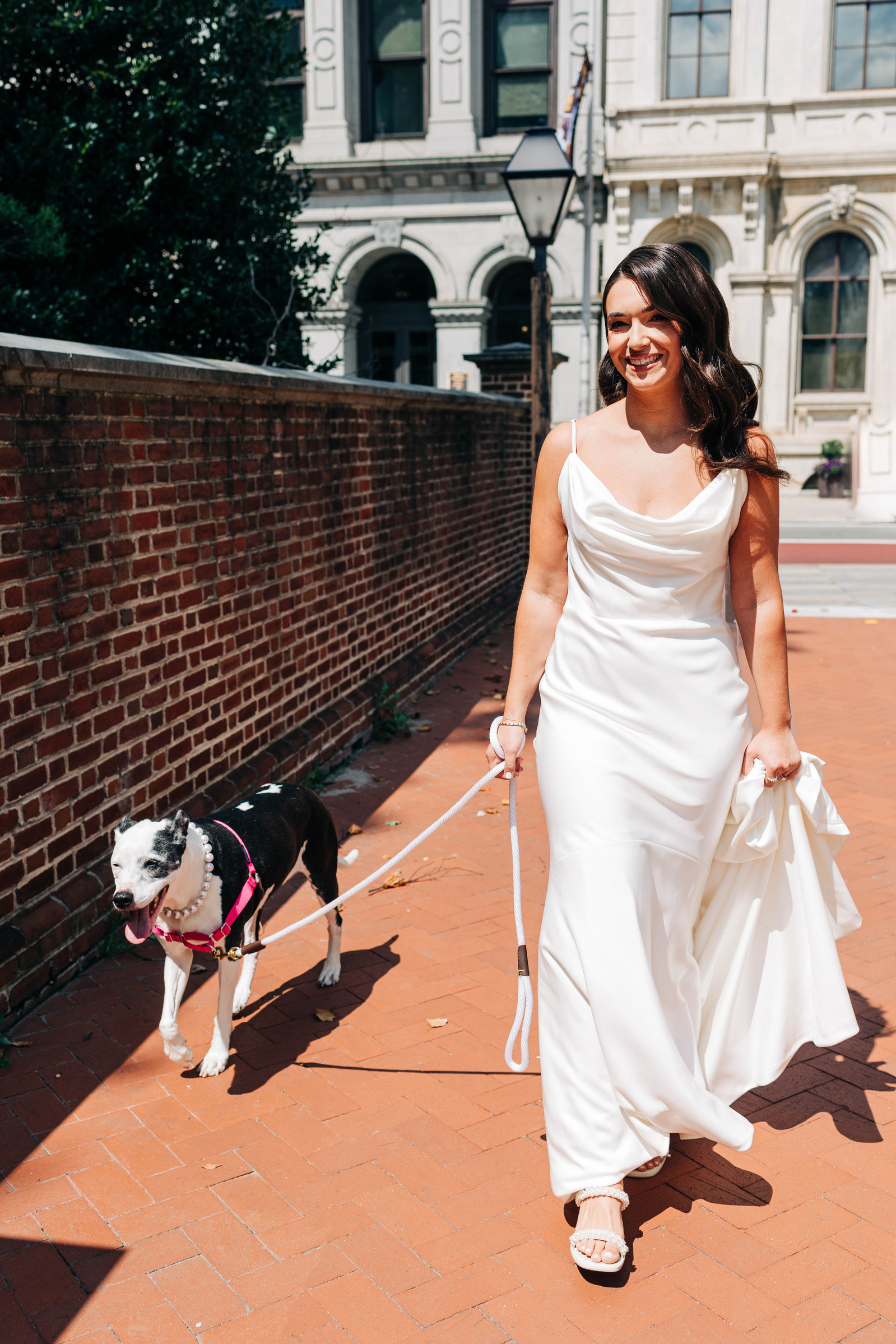 old city philadelphia wedding photography of bride walking in philly with her dog