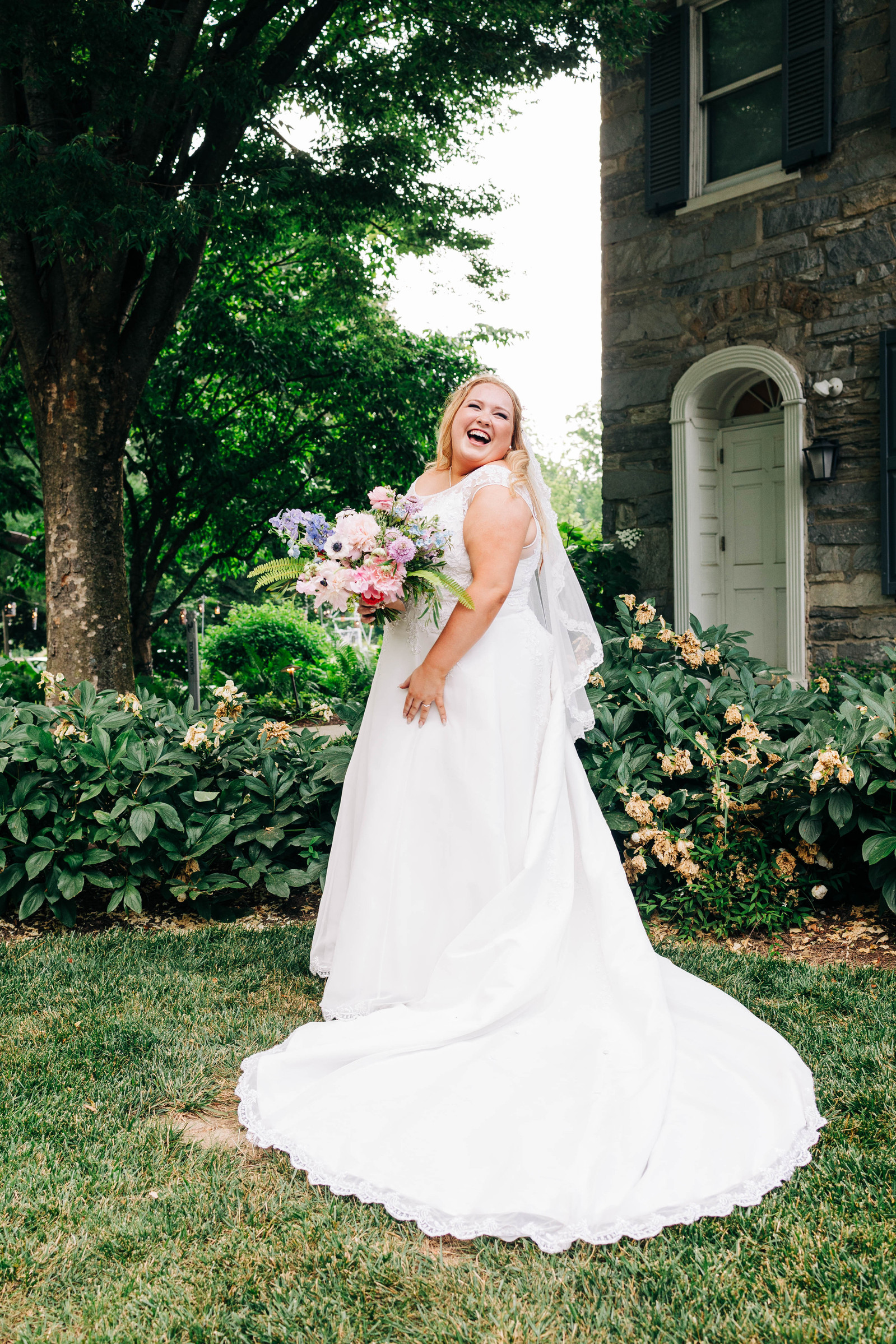 bride smiling on her wedding day at the farmhouse at people's light theater in malvern pennsylvania