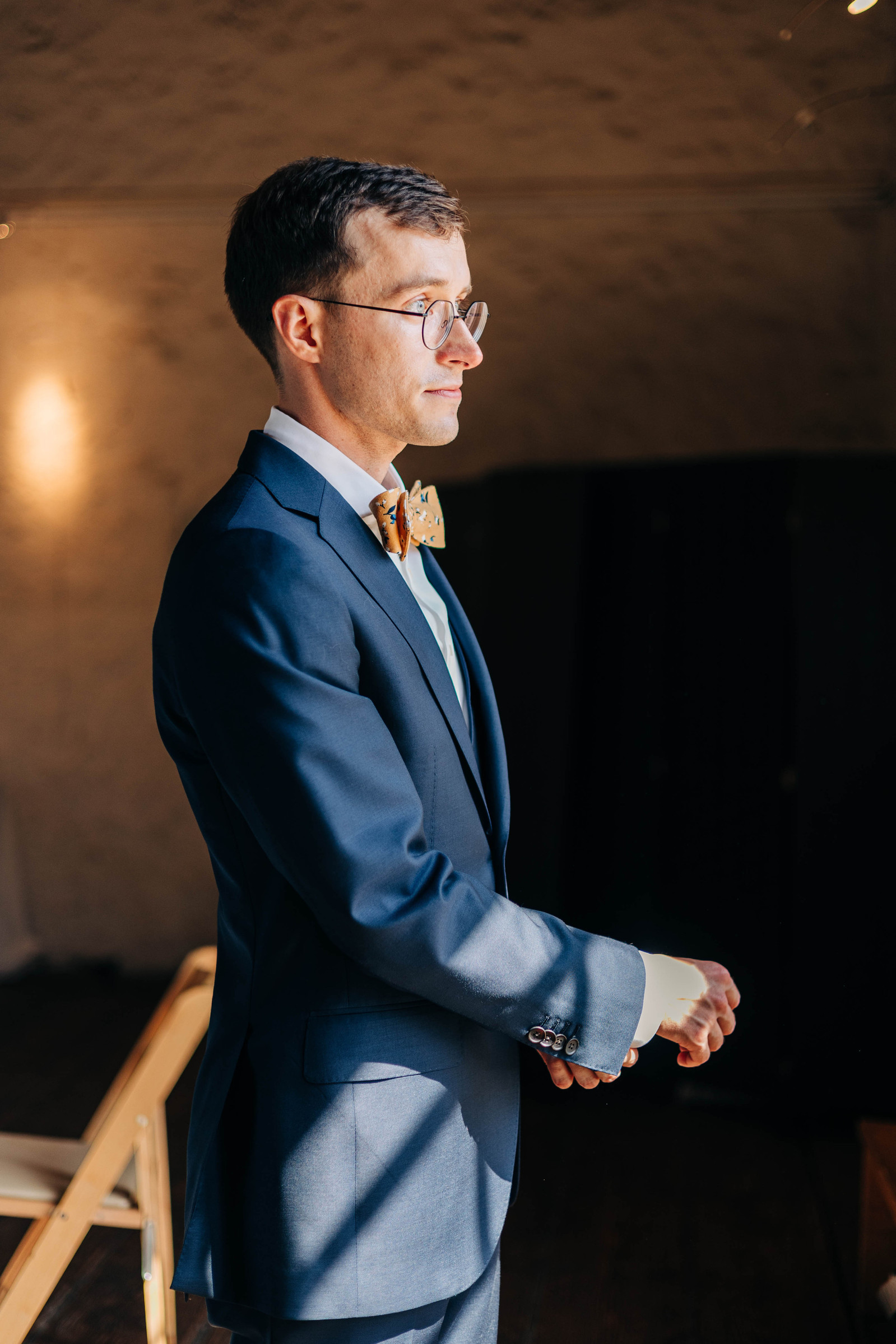 portrait of groom getting ready at bartram's garden in philadelphia
