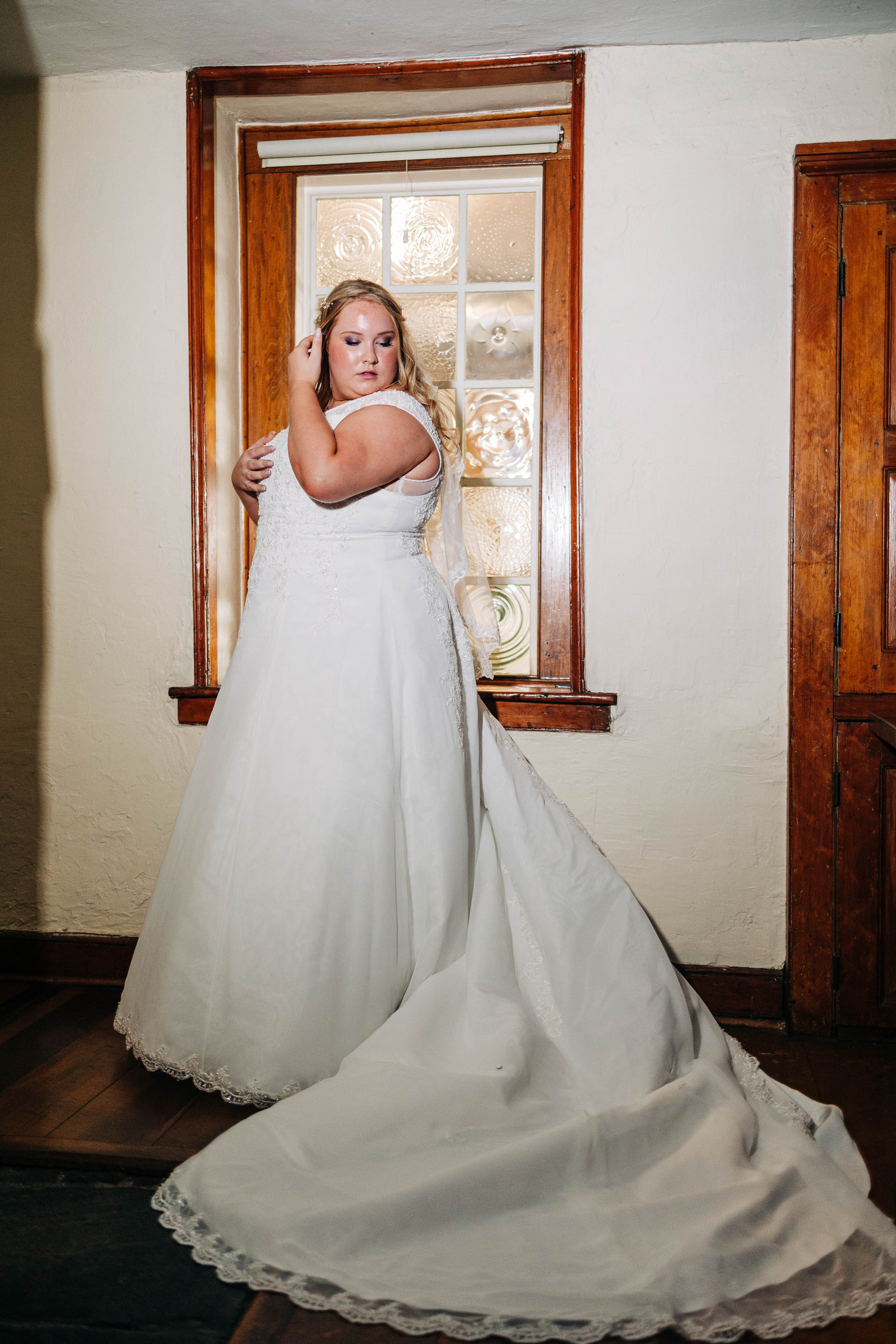 indoor portrait with direct light of bride in bridal suite on wedding day