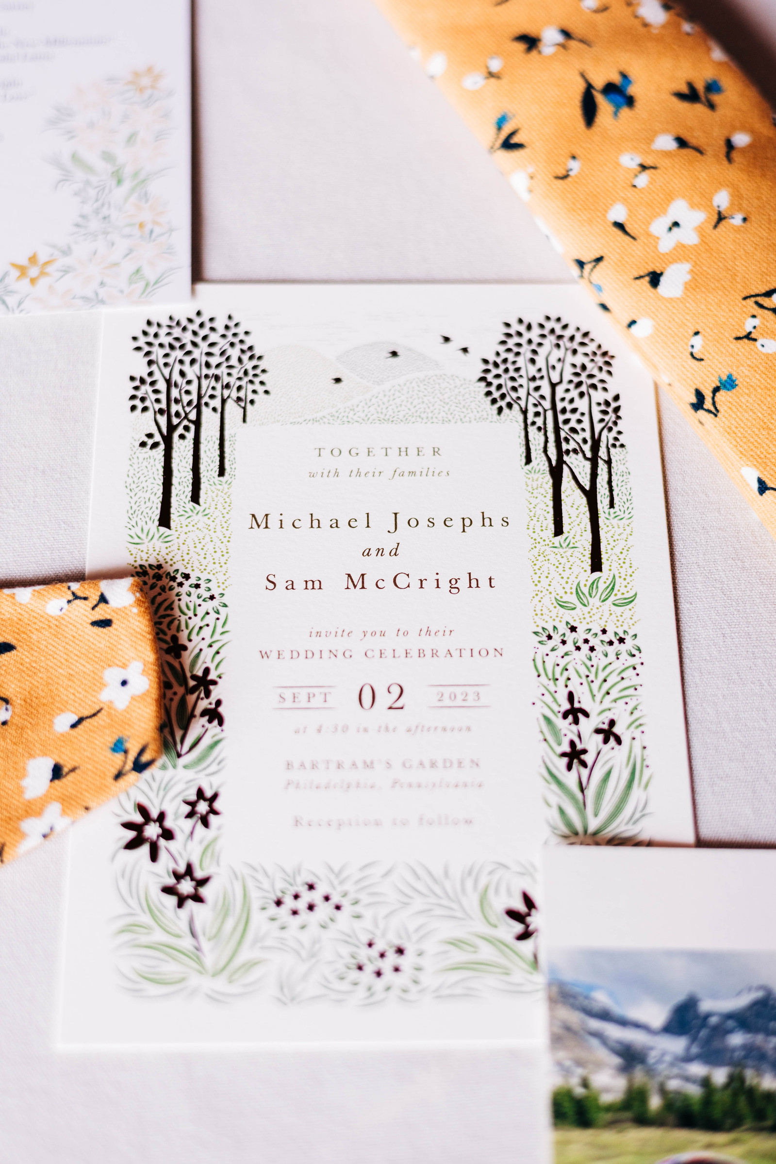 wedding day flatlay with invitation and tie