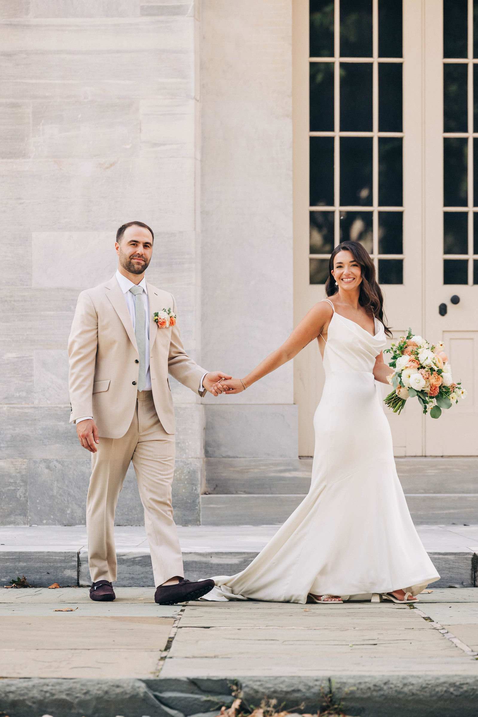 bride and groom portraits at merchant's exchange building in philadelphia