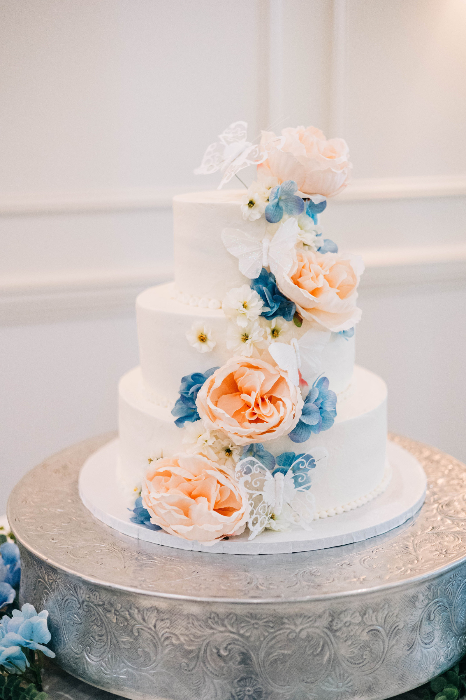 wedding cake with pastel florals
