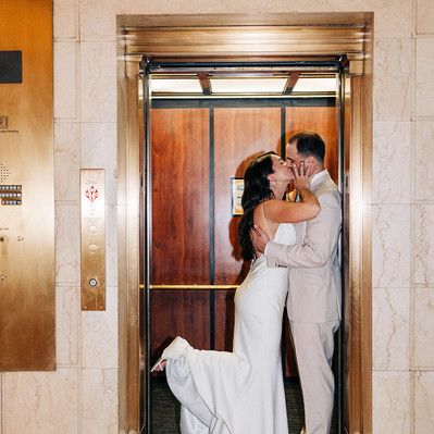 Direct flash photography with bride and groom kissing in elevator at the Downtown Club by Cescaphe wedding in Old City Philadelphia