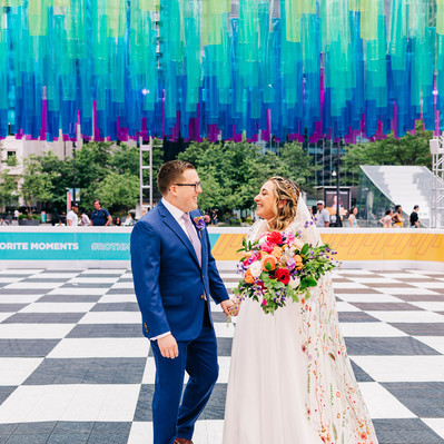 Colorful unique wedding photos at the roller rink at Philadelphia City Hall