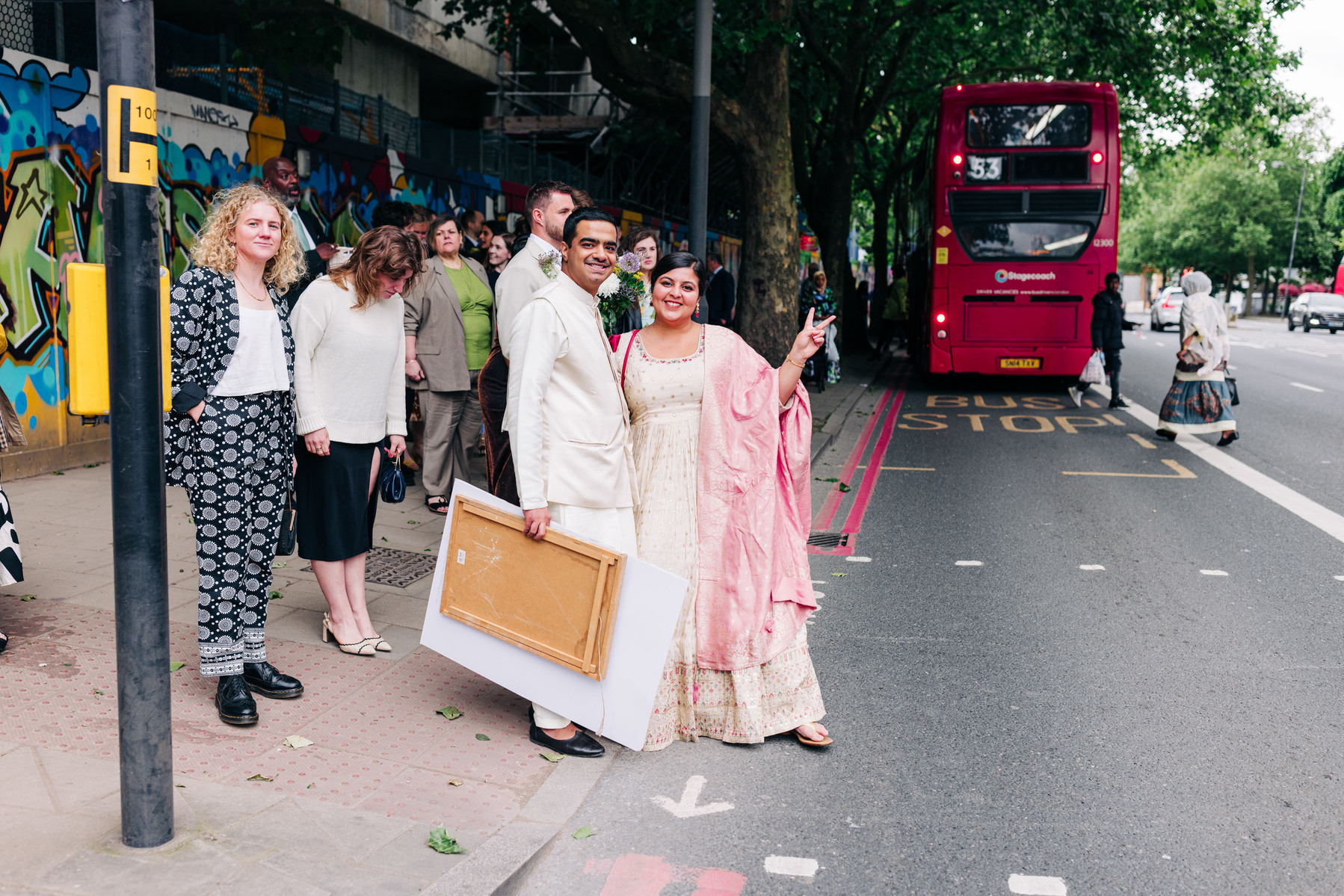 colorful multicultural british indian wedding at asylum chapel in london england UK cocktail hour candid documentary wedding photography