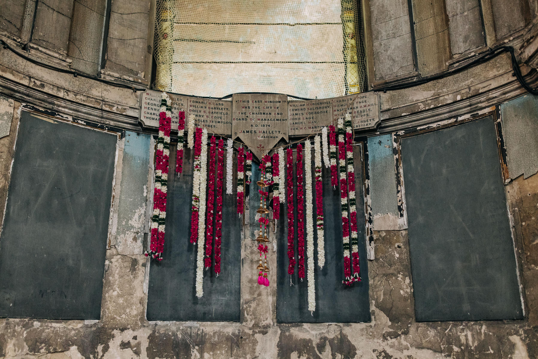London wedding at Asylum chapel colorful flower garland altar backdrop Indian wedding decor inspo