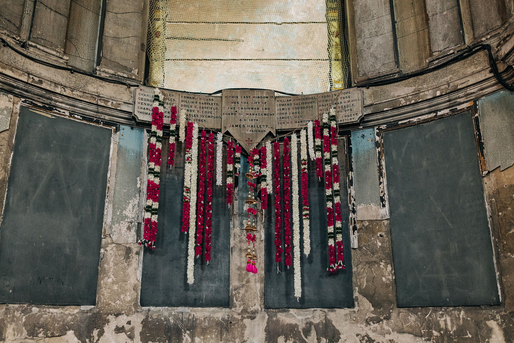 London wedding at Asylum chapel colorful flower garland altar backdrop Indian wedding decor inspo