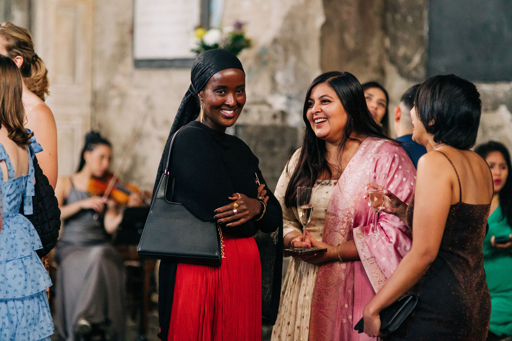 colorful multicultural british indian wedding at asylum chapel in london england UK cocktail hour candid documentary wedding photography
