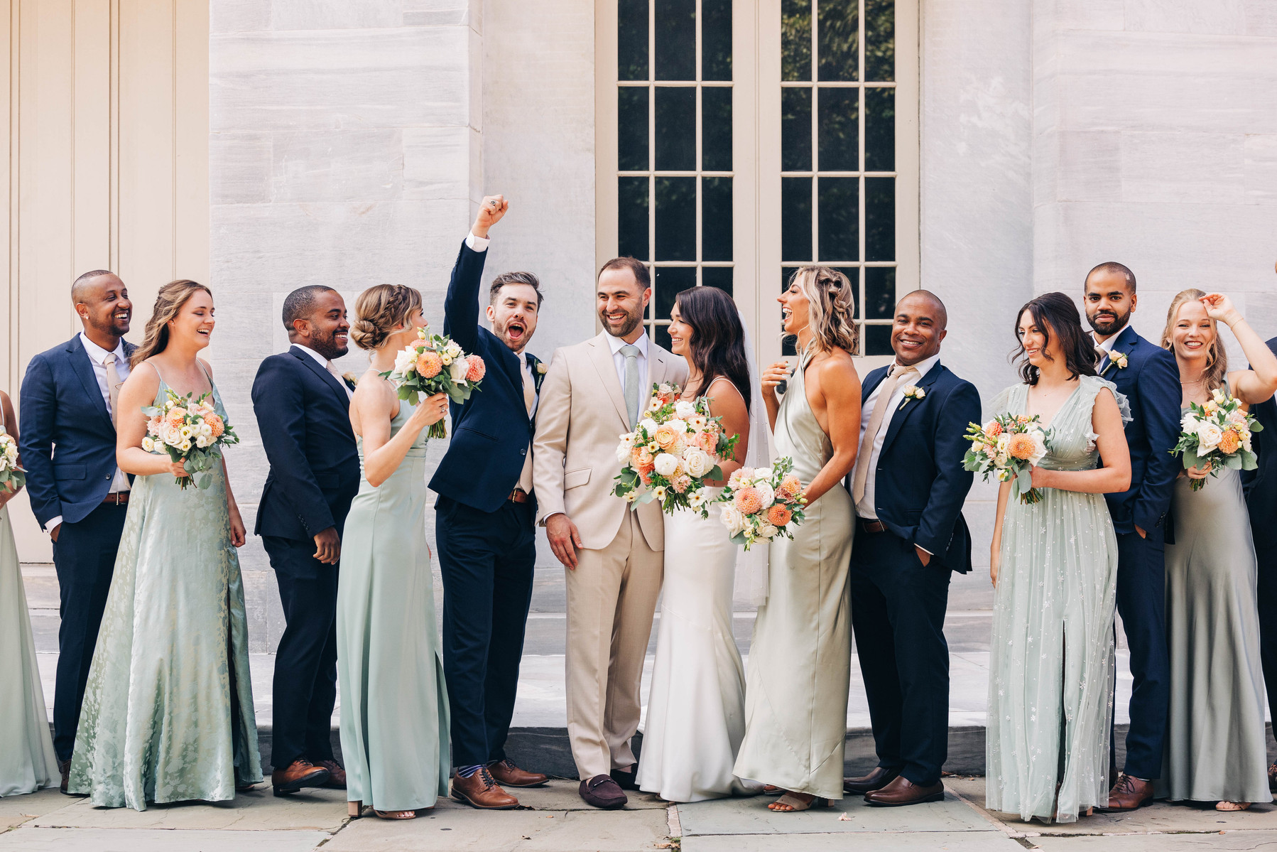 group photos of bride and groom with wedding party at the merchant's exchange building in old city philadelphia