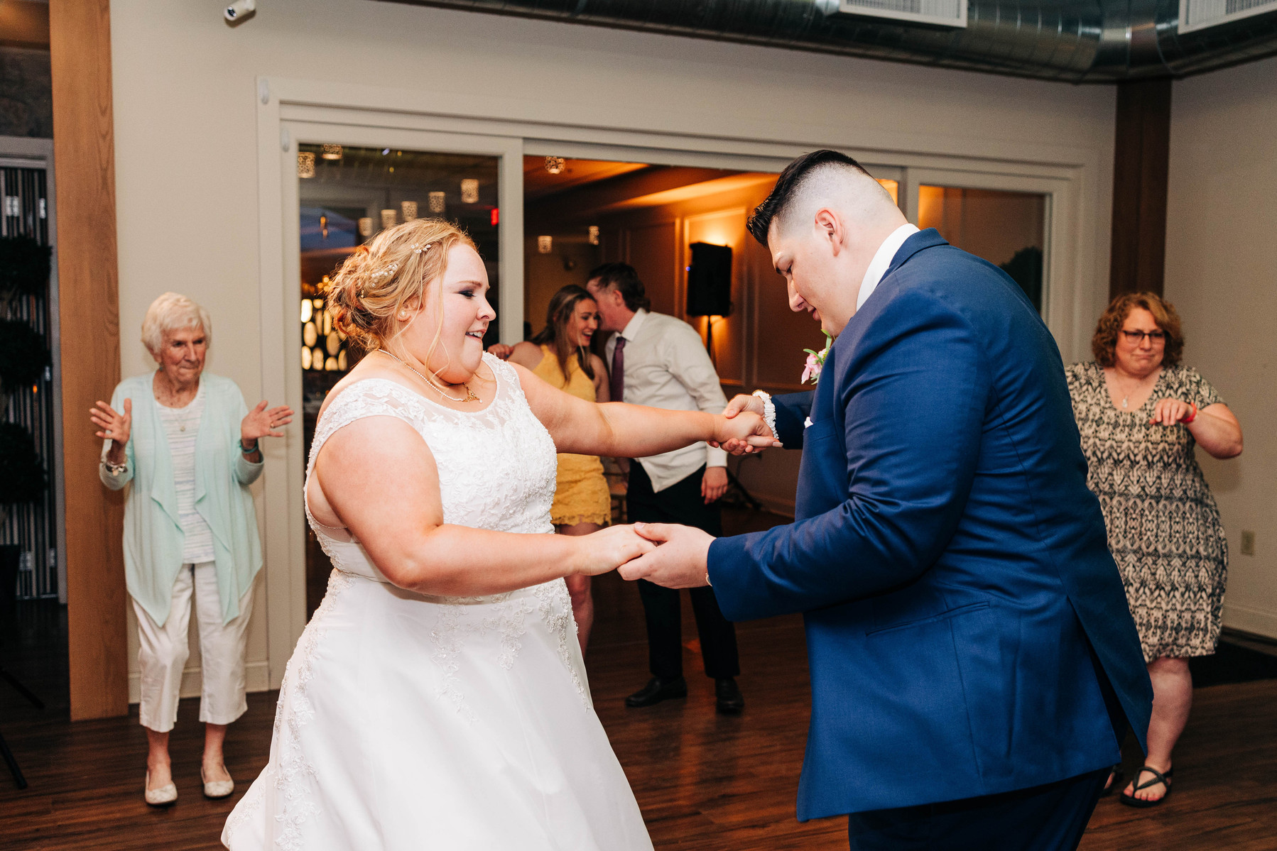 bride and groom dance during wedding reception at the farmhouse at people's light theater in malvern pennsylvania