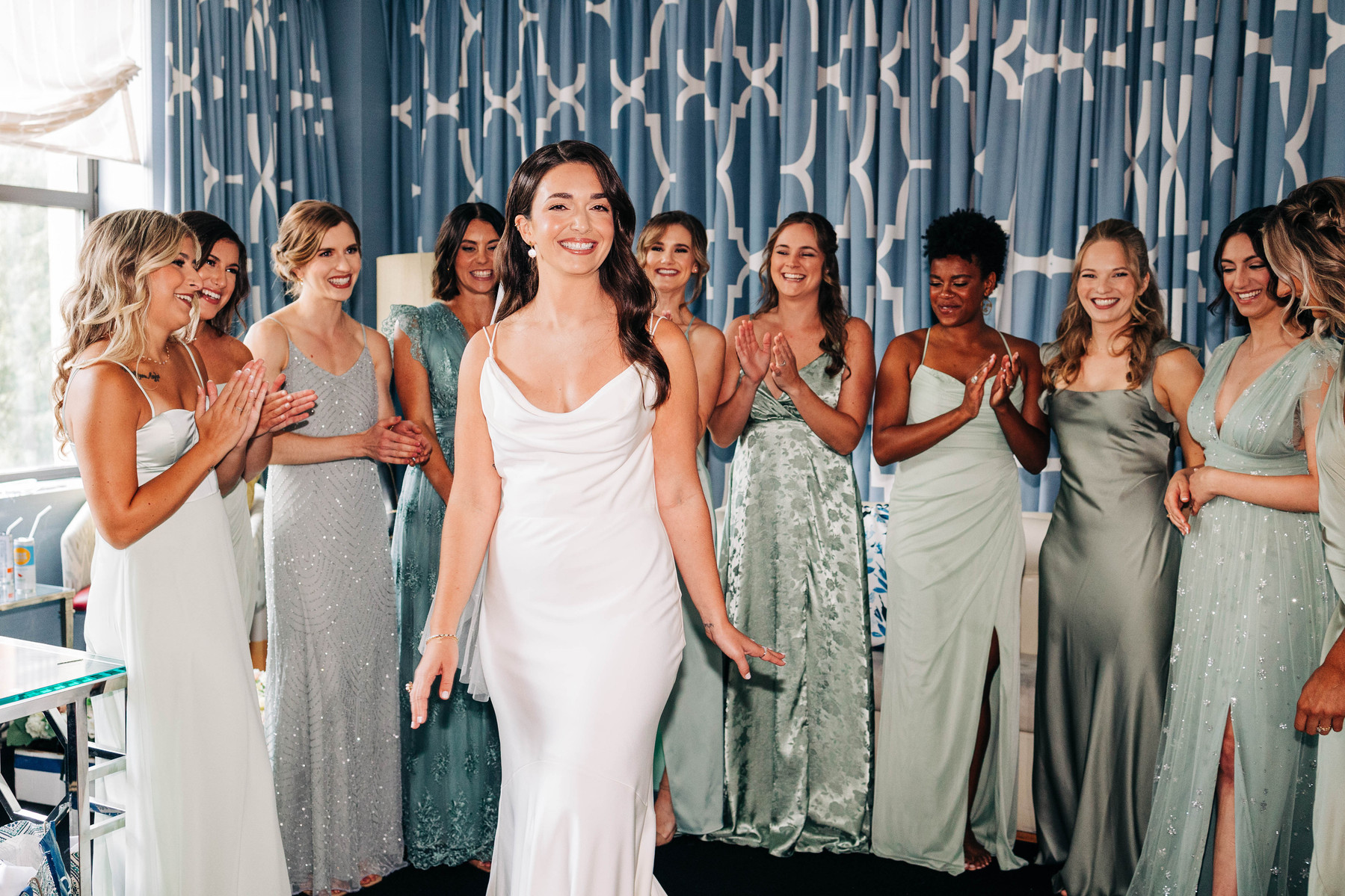 first look photo of bride with bridesmaids getting ready at hotel monaco philadelphia