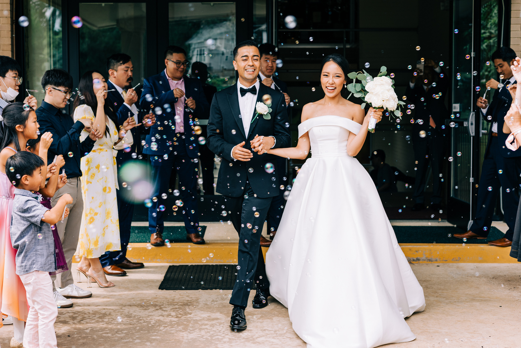 bubble exit from church with bride and groom
