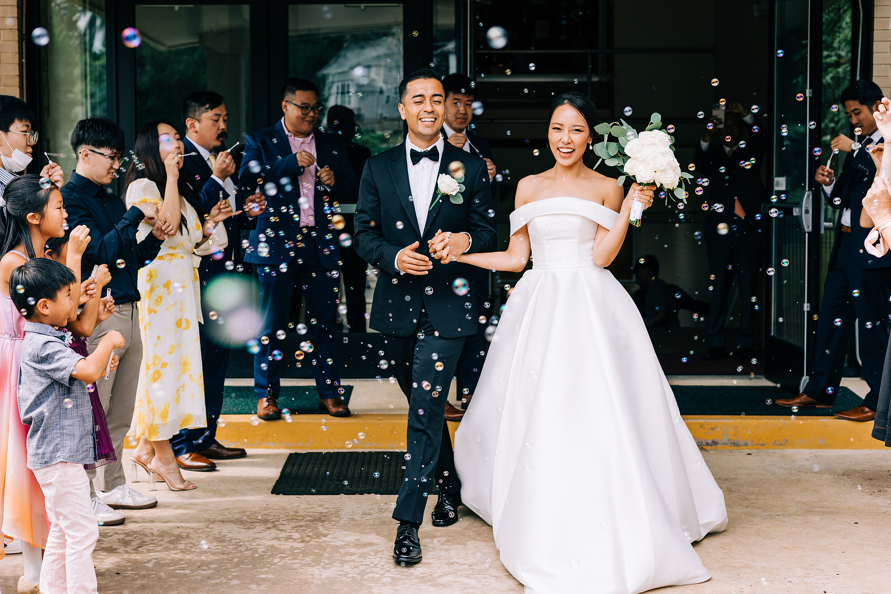 bubble exit from church with bride and groom