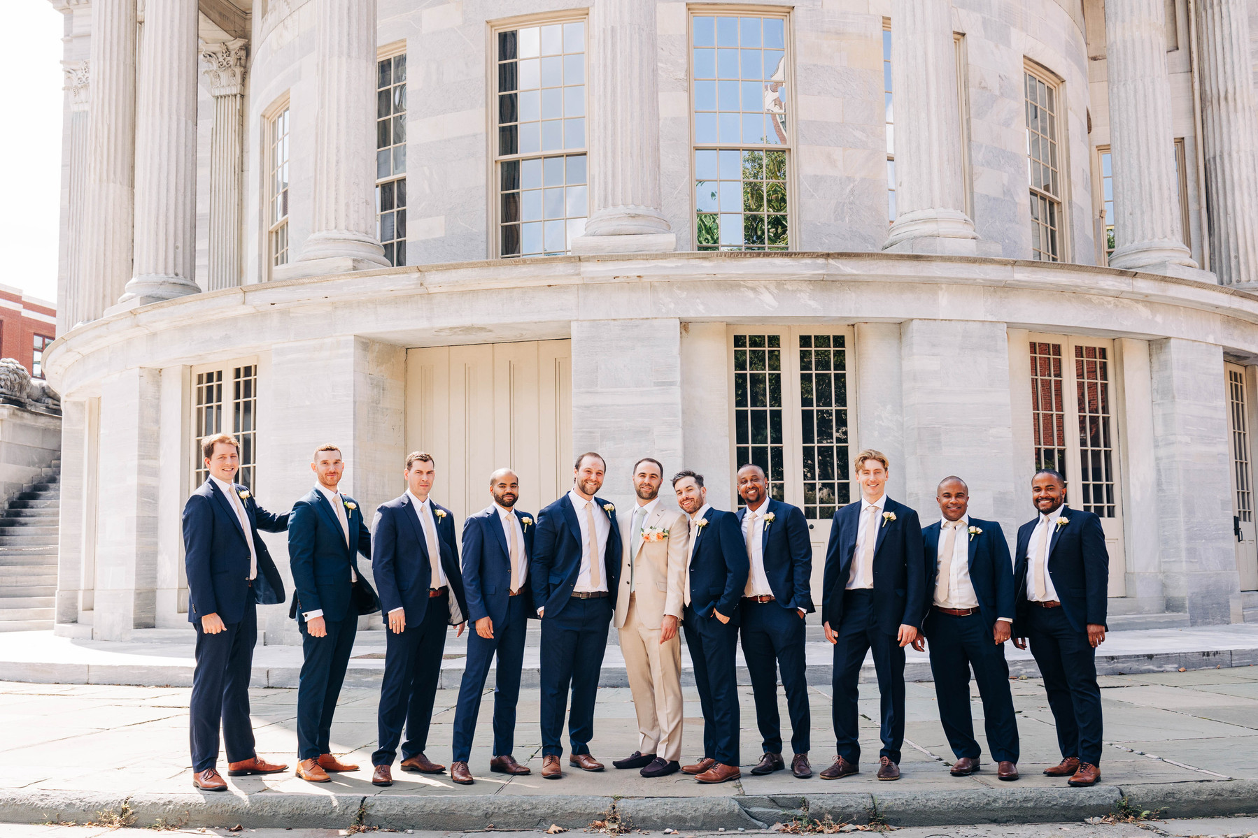group photo of groom with groomsmen at the merchant's exchange building in philadelphia 