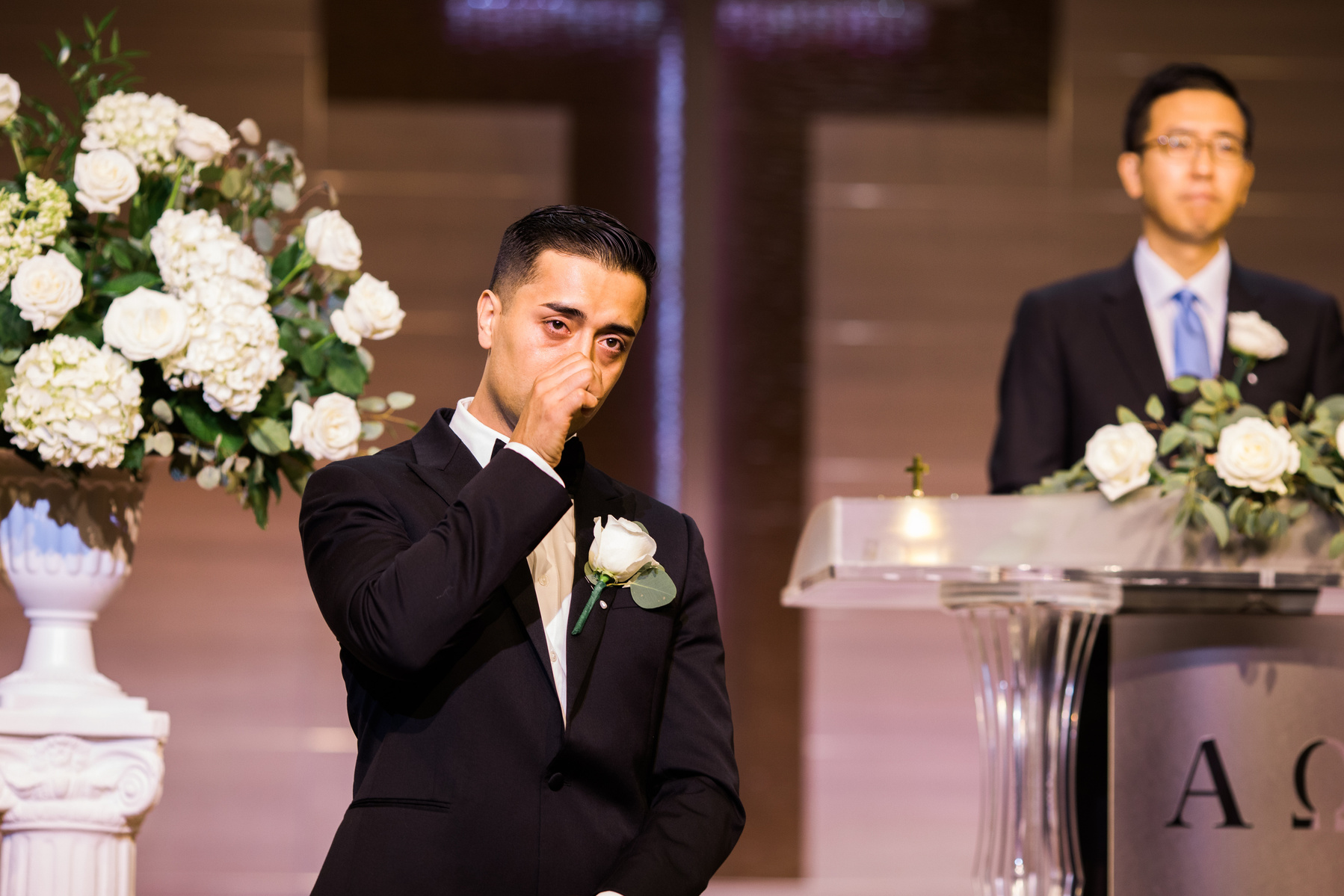 groom gets emotional seeing bride for the first time on their wedding day 