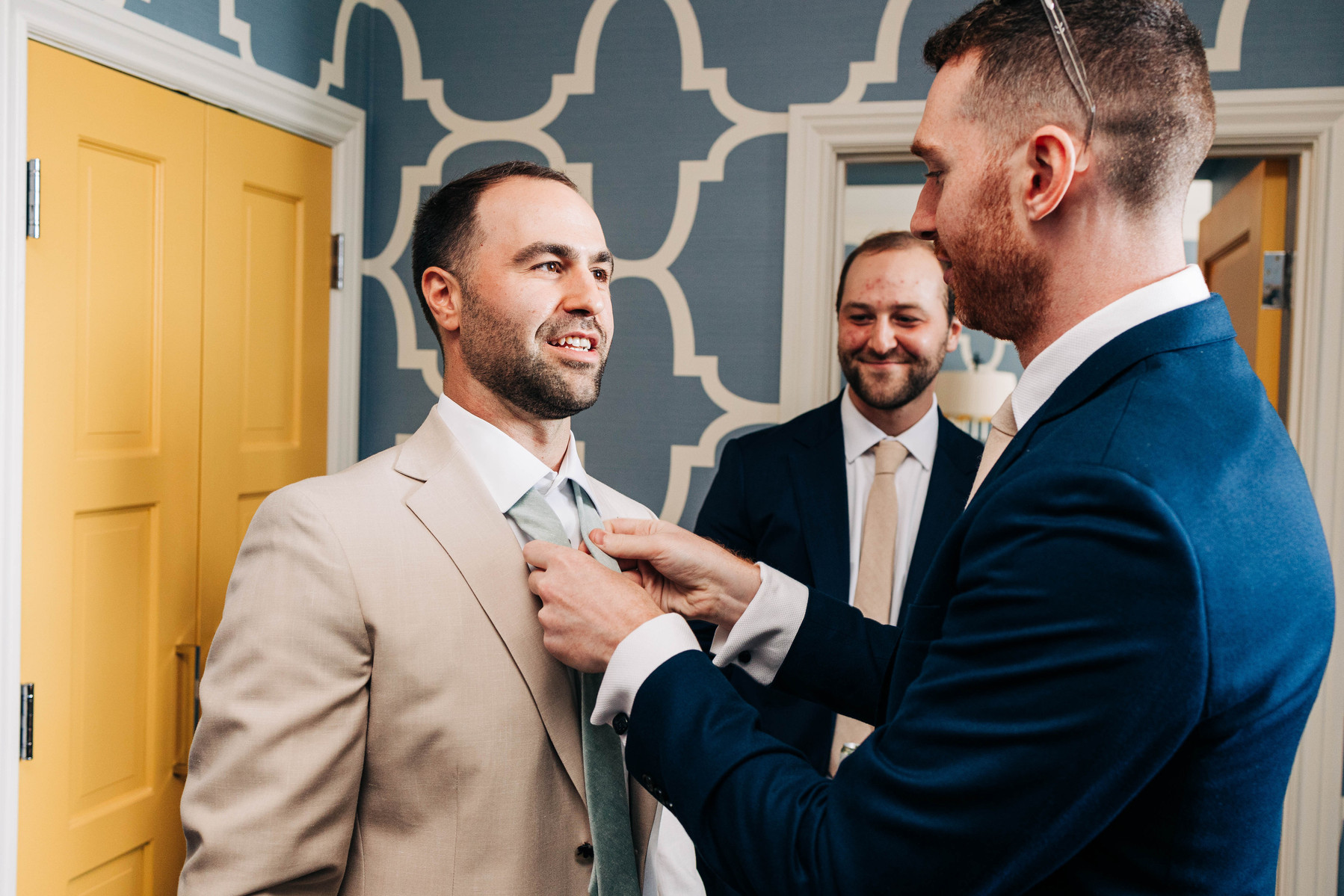 groom getting ready with groomsmen on wedding day at hotel monaco philadelphia