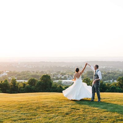sunset photo of bride and groom dancing at the view at morgan hill wedding