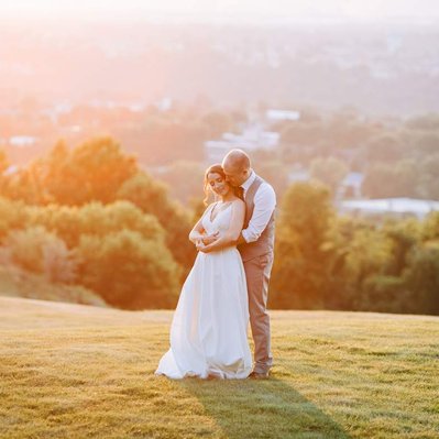sunset photo of bride and groom dancing at the view at morgan hill wedding