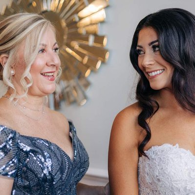 bride and mother of bride getting ready the ballroom at ellis preserve finley catering wedding photography