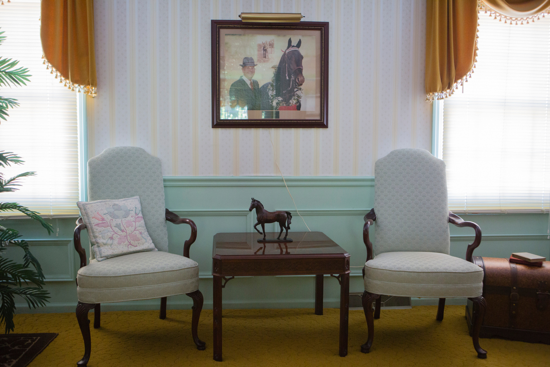 A photograph of Rick with his prize-winning horse "Final's Threat Supreme" is a centerpiece of the Schemel home.