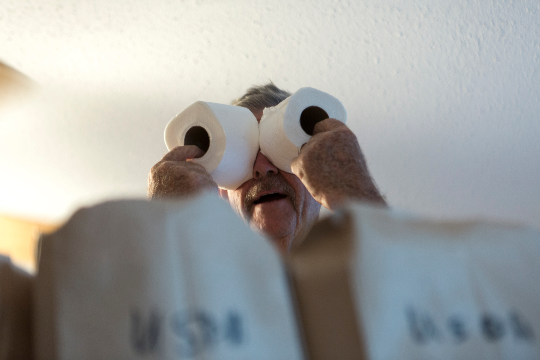 Rick is a consumate jokester. Rick and his friends help Claire at the Ladies of Charity food pantry to distribute bags of groceries to those in need. The weekly meeting is as much social gathering as it is a charity event. (Photographer's note: for the f
