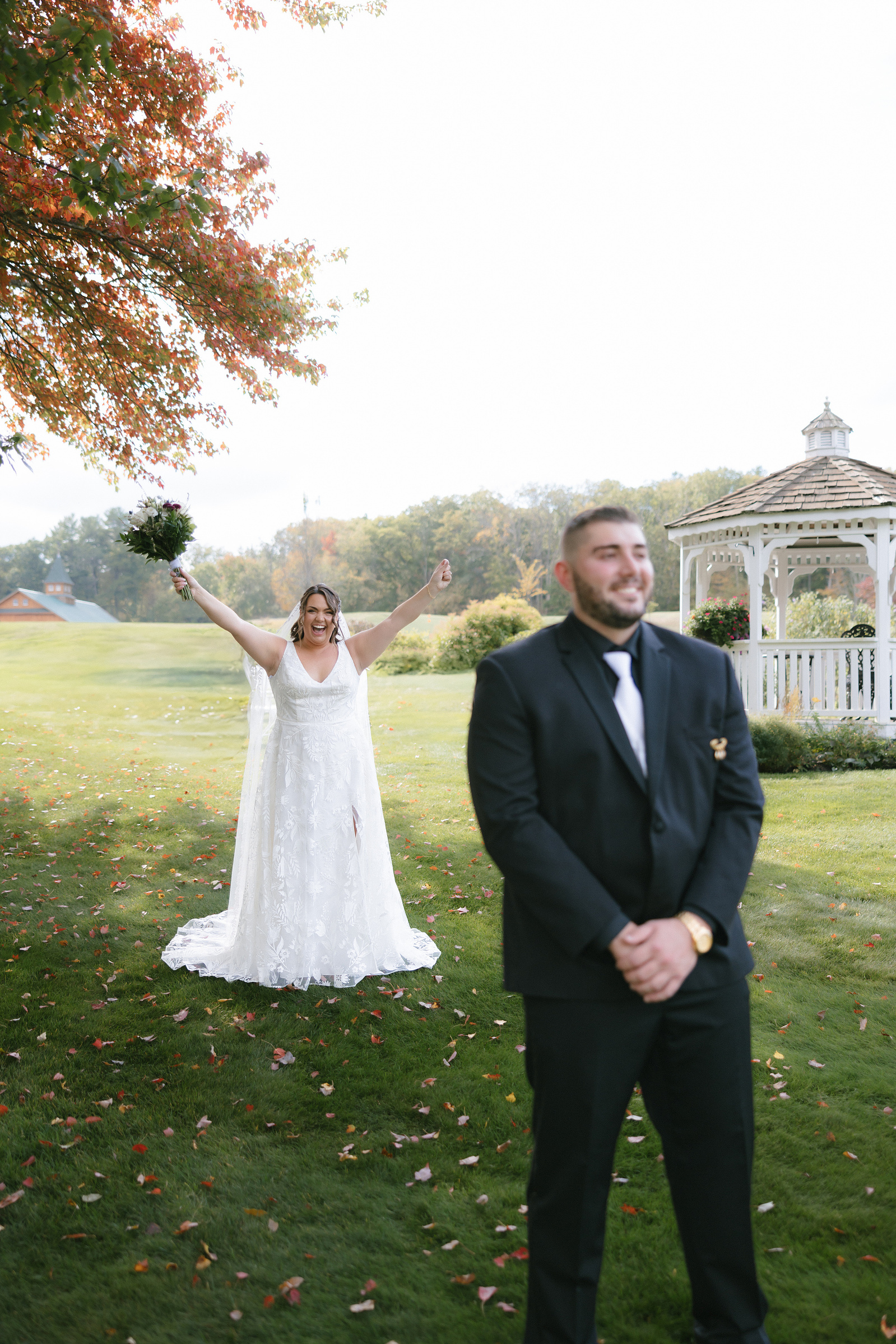 Bride standing behind her groom before the first look. 