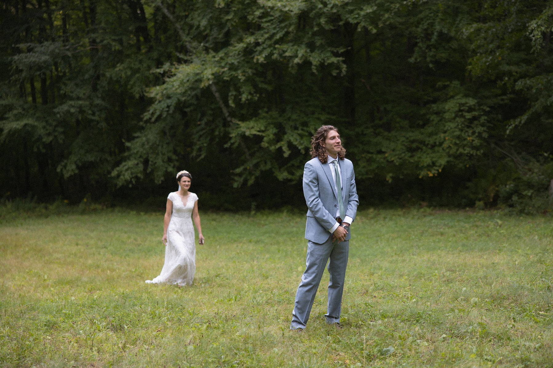 Bride walking up to groom to do their first looks. 