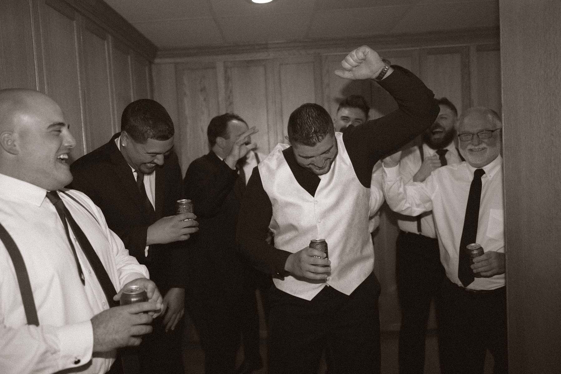 Groomsmen cheering for the groom. 